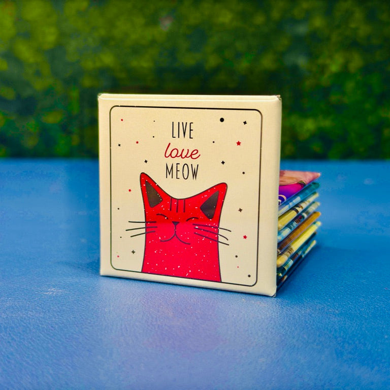Retro-style square magnet featuring a happy pink cartoon cat surrounded by stars and the phrase “Live Love Meow.” A sweet and playful gift for cat lovers, cat moms, and pet owners who adore cute feline-themed decor. The distressed design adds a vintage touch, making it perfect for fridges, lockers, or office boards. Great as a gift, stocking stuffer, or everyday cat affirmation.