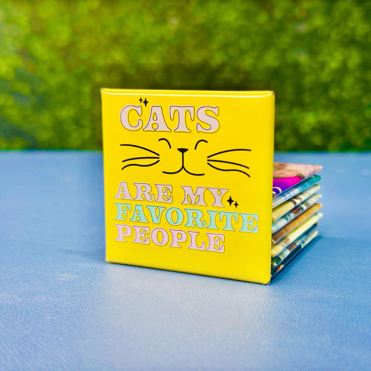 Bright and cheerful square cat magnet featuring the phrase “Cats Are My Favorite People” in pastel purple, pink, teal, and yellow with a smiling cat face and whiskers. A fun and colorful gift for cat lovers, pet owners, and feline fanatics. Perfect for decorating fridges, lockers, or office boards. Makes a great birthday gift, stocking stuffer, or everyday reminder of your love for cats