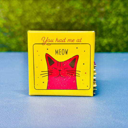 Bright and playful square magnet featuring a smiling pink cartoon cat on a yellow background with the phrase “You Had Me at Meow.” A fun and heartwarming gift for cat lovers, pet owners, and cat moms. Perfect for decorating fridges, lockers, or office spaces. Great as a small gift, stocking stuffer, or magnet for anyone who’s ever fallen in love with a feline friend.