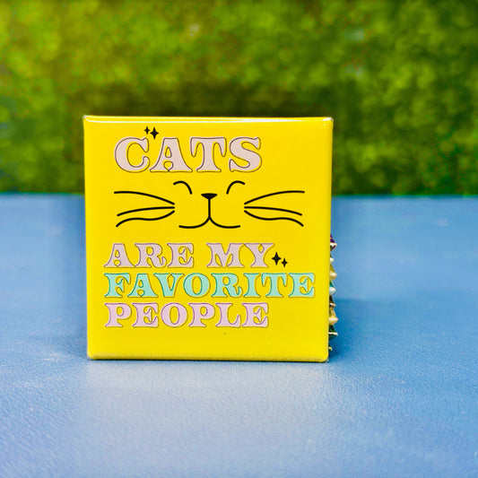 Bright and cheerful square cat magnet featuring the phrase “Cats Are My Favorite People” in pastel purple, pink, teal, and yellow with a smiling cat face and whiskers. A fun and colorful gift for cat lovers, pet owners, and feline fanatics. Perfect for decorating fridges, lockers, or office boards. Makes a great birthday gift, stocking stuffer, or everyday reminder of your love for cats