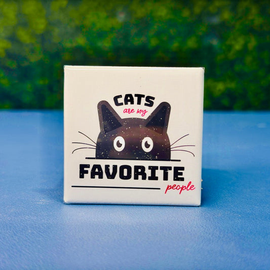 Square cat magnet featuring a bold black cartoon cat peeking up under the phrase “Cats Are My Favorite People” in playful black and red fonts. A cute and cheeky gift for cat lovers, pet moms, or anyone who’d choose a feline over a human any day. Perfect for fridge decor, office spaces, lockers, or as a funny stocking stuffer. A must-have for anyone proudly obsessed with their cats.