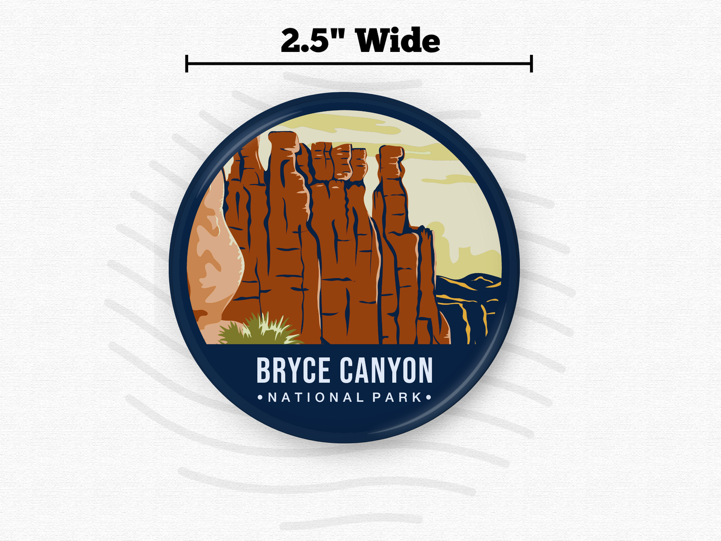 Round magnet of Bryce Canyon National Park showcasing tall red rock hoodoos under a pale yellow sky with distant canyon ridges.”