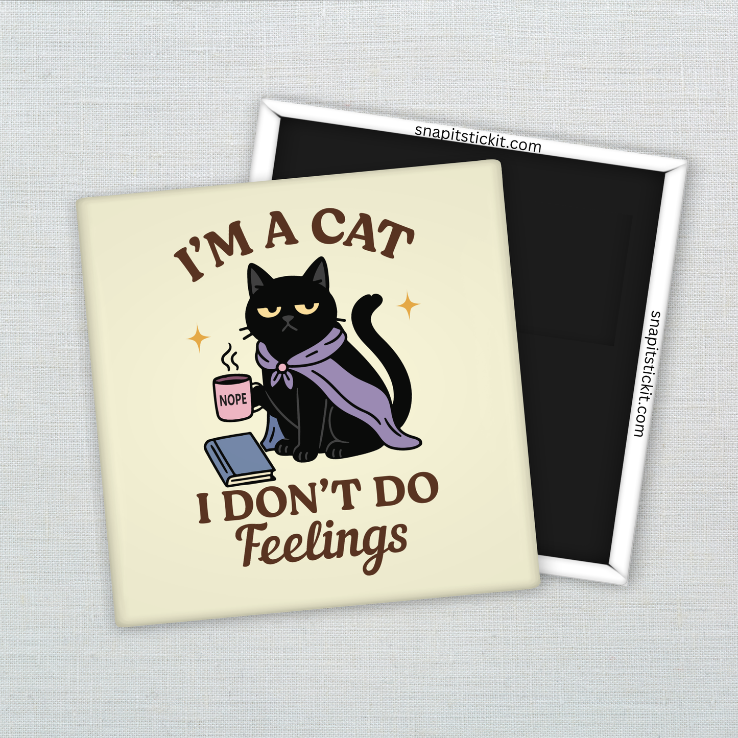 Black cat in purple cloak holding a pink mug labeled “NOPE,” sitting with a book. Surrounded by quote: “I’m a cat. I don’t do feelings.” 2x2 sarcastic magnet.