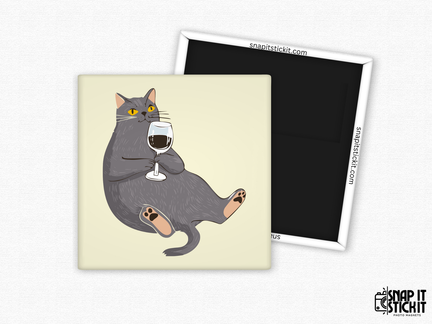 Funny wine cat magnet – square 2x2” fridge magnet with a dark gray cartoon cat lounging with a glass of red wine. Strong magnetic back shown with Snap It Stick It branding. Great gift for cat lovers and wine enthusiasts.