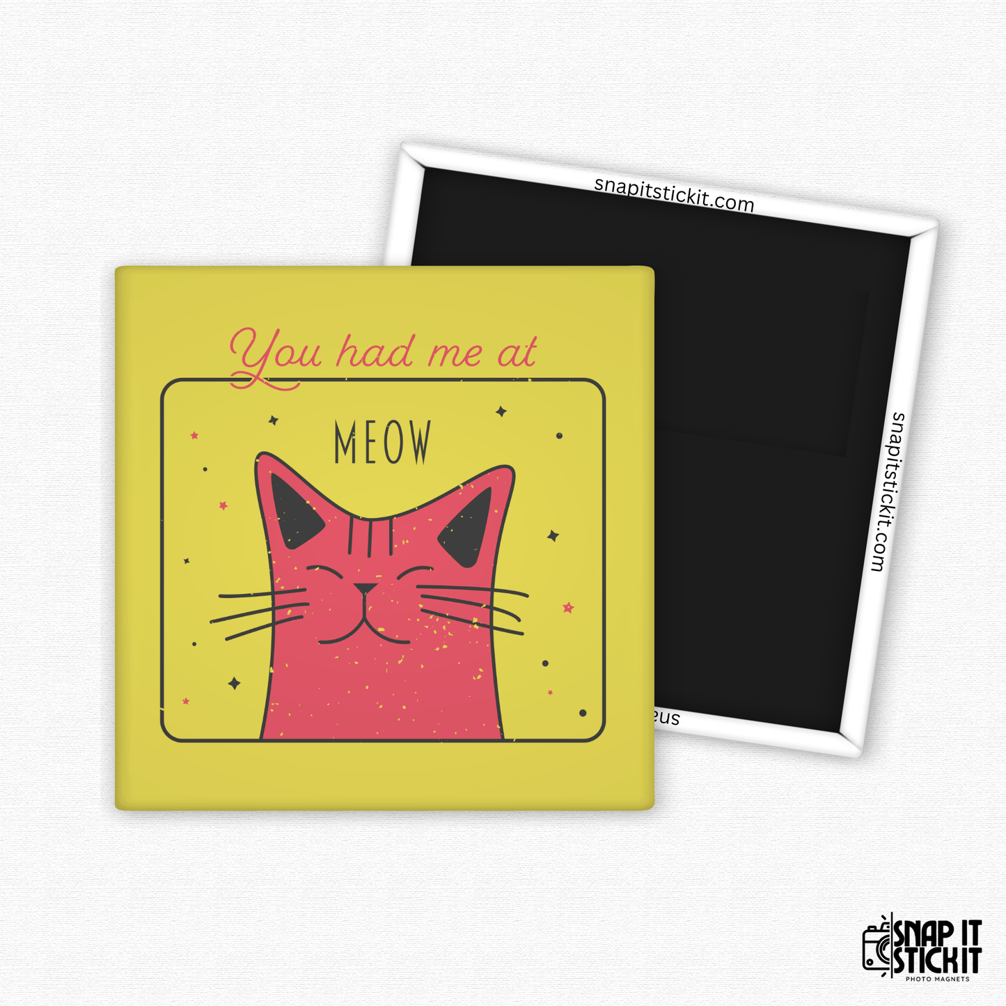 Fridge magnet with a pink cat illustration and "you had me a meow" on a yellow background