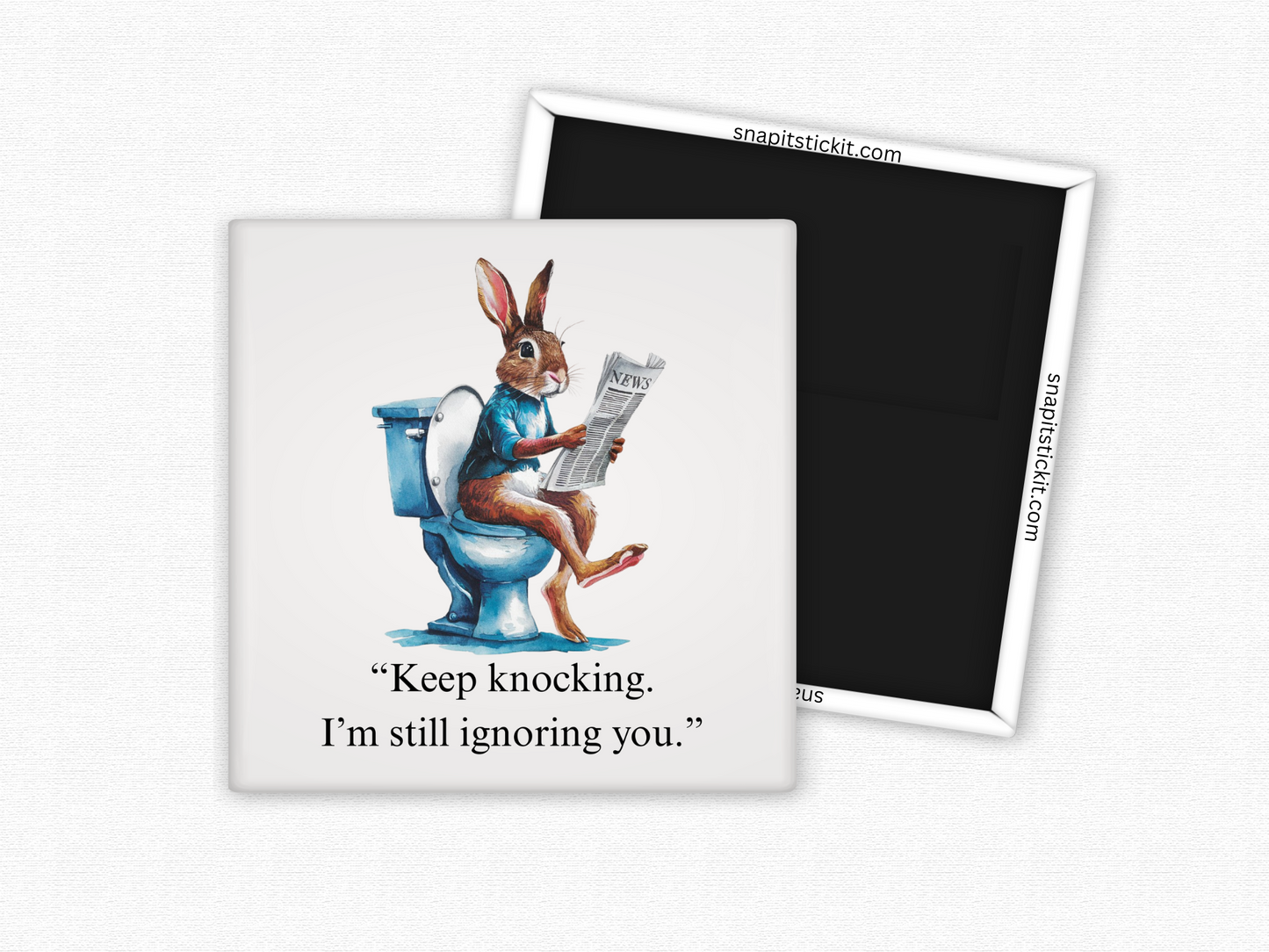 Funny rabbit bathroom magnet with a bunny on the toilet reading a newspaper and the quote “Keep knocking, I’m still ignoring you.”