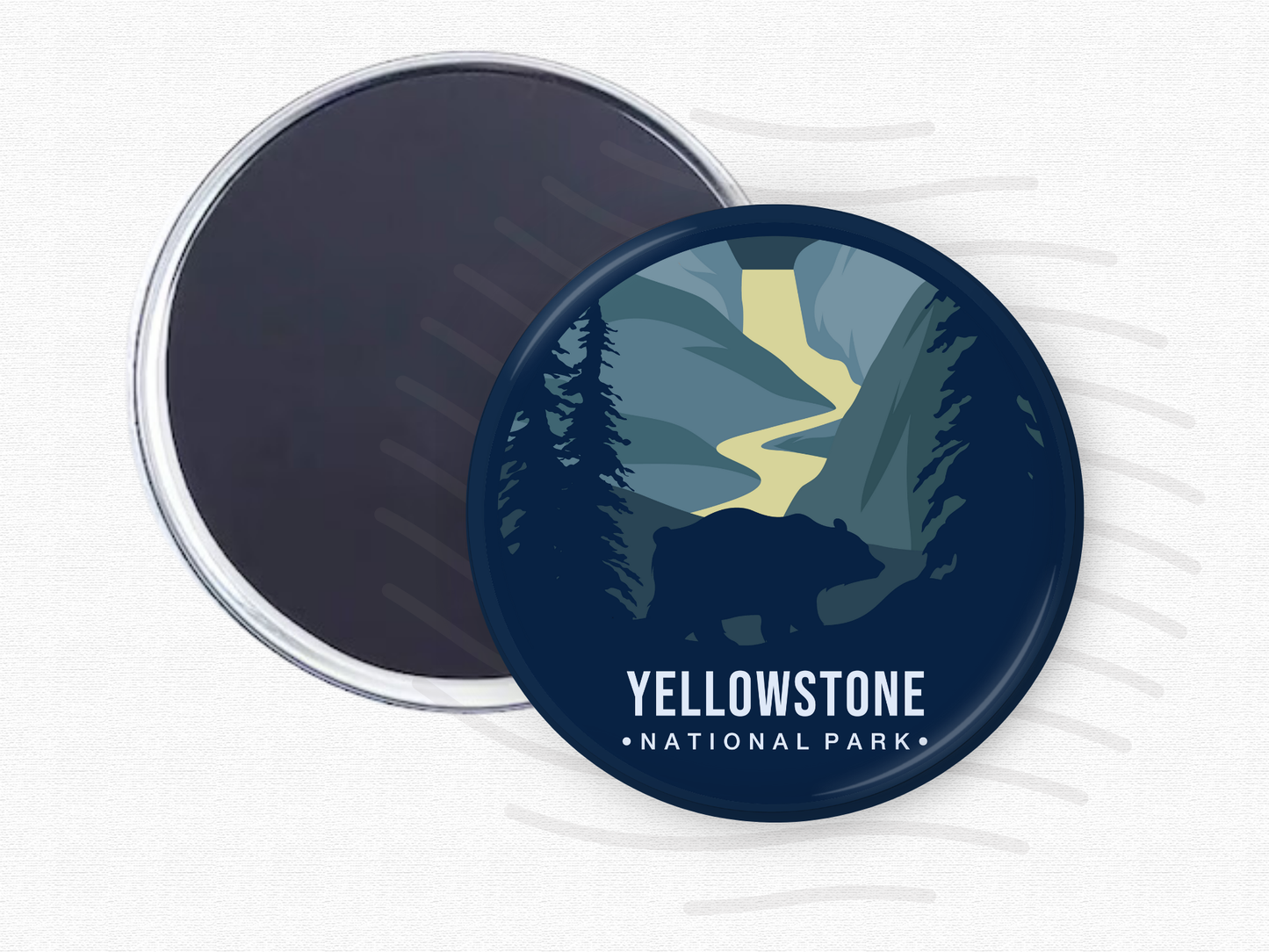 ound magnet of Yellowstone National Park featuring a silhouette of a bear in the foreground, a winding yellow river, and dark blue evergreen trees set against towering canyon walls.