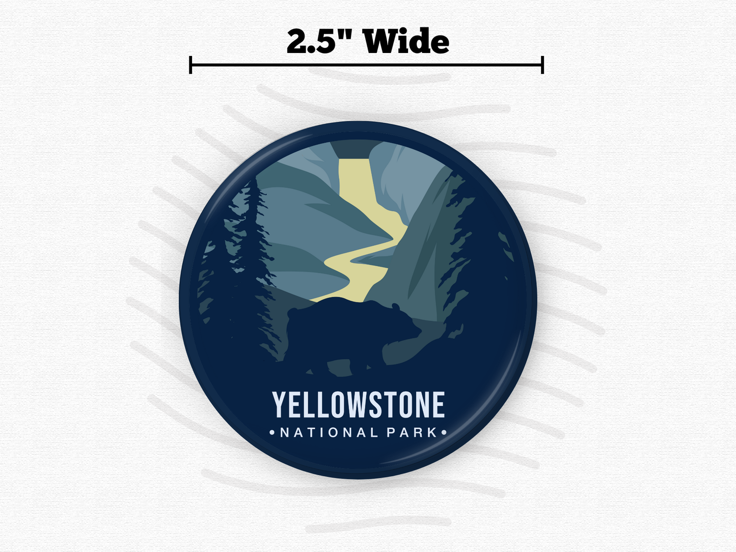 ound magnet of Yellowstone National Park featuring a silhouette of a bear in the foreground, a winding yellow river, and dark blue evergreen trees set against towering canyon walls.