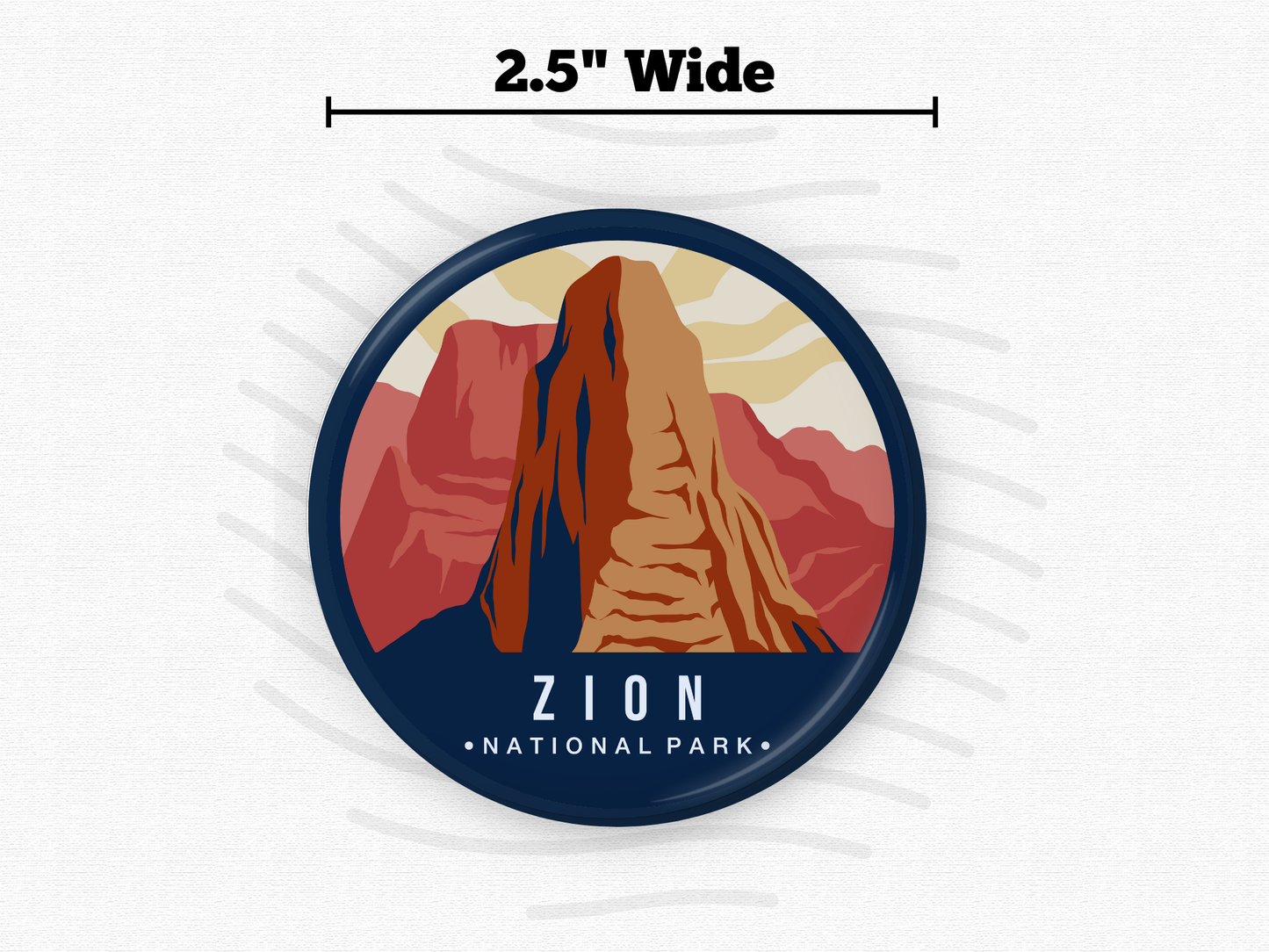 Round magnet of Zion National Park featuring a towering red and orange rock formation under a partly cloudy sky with warm tones
