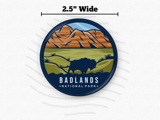 Badlands National Park magnet – 2.5” round fridge magnet with bold artwork of rugged orange rock formations and a grazing bison on the prairie. Magnet back partially visible. Great gift for nature lovers, wildlife fans, and national park collectors.