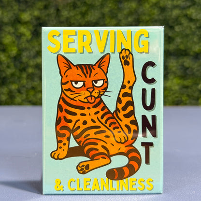 Magnet with bengal cat illustration and text on a surface with a blurred background