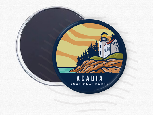 Acadia National Park magnet – 2.5” round fridge magnet featuring a colorful illustration of a lighthouse on rocky cliffs with evergreen trees and a sunset sky. Strong magnetic back shown. Ideal souvenir or gift for national park lovers and travelers.