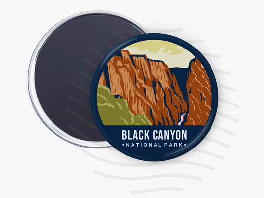 Round magnet featuring Black Canyon of the Gunnison National Park with steep red rock cliffs, green foliage, and a dramatic vertical gorge.