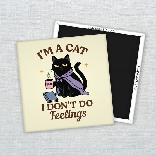 Black cat in purple cloak holding a pink mug labeled “NOPE,” sitting with a book. Surrounded by quote: “I’m a cat. I don’t do feelings.” 2x2 sarcastic magnet.