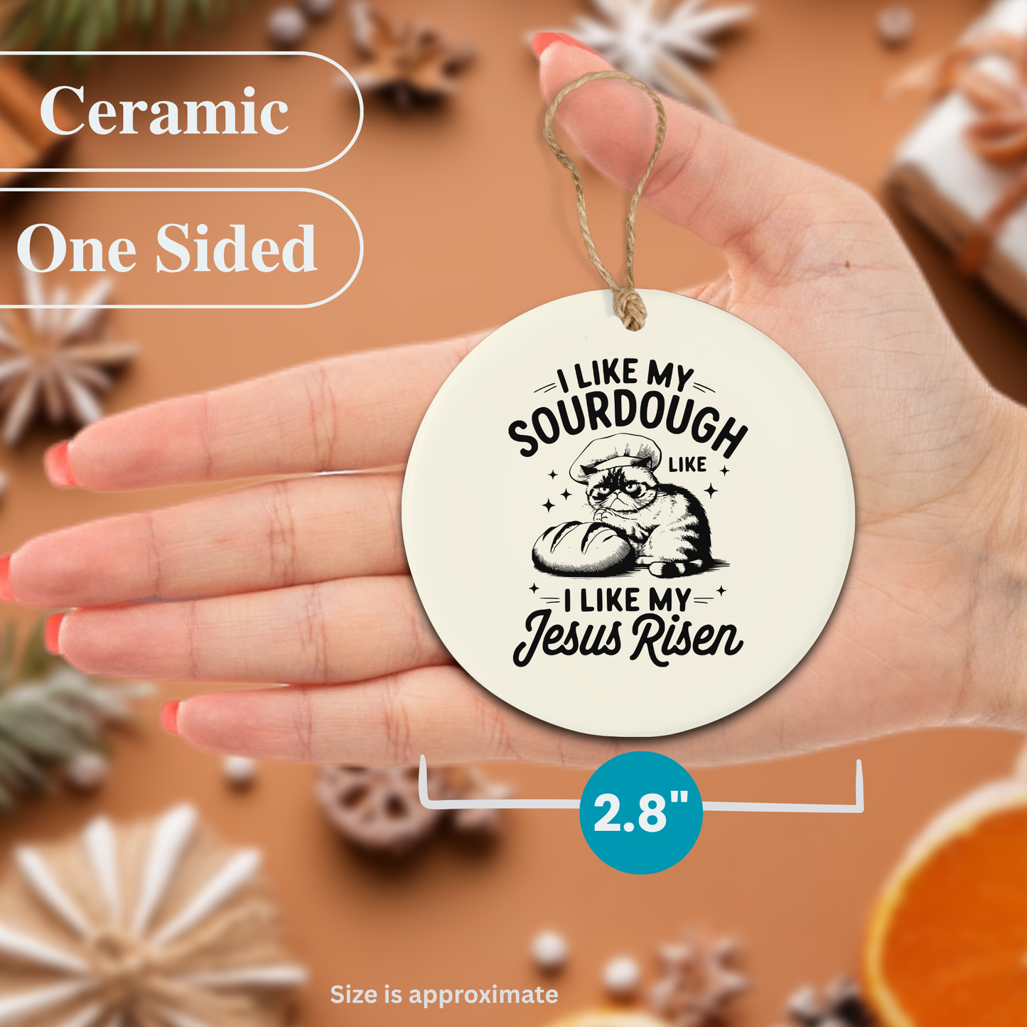 Ceramic ornament with text held in a hand, surrounded by decorative items.