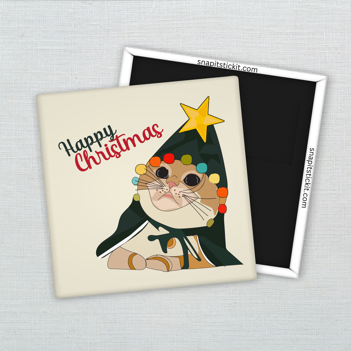 Orange cat dressed as a Christmas tree with tangled lights and a star on its head, under the words “Happy Christmas.” Funny 2x2 holiday magnet.