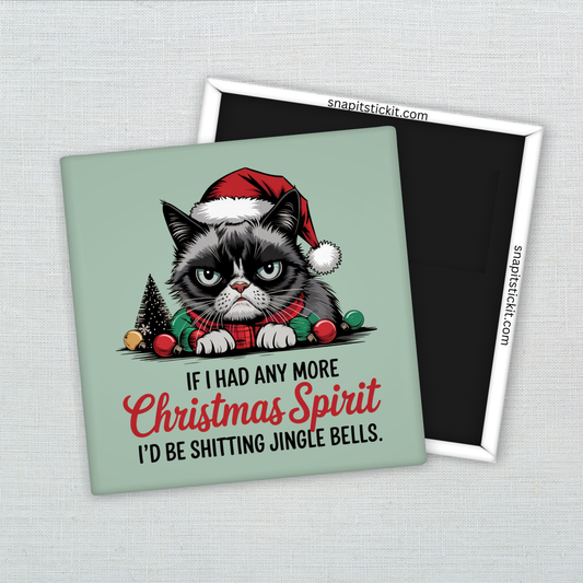 Grumpy cartoon-style cat in Santa hat surrounded by Christmas ornaments with the quote: “If I had any more Christmas spirit, I’d be shitting jingle bells.” 2x2 magnet.