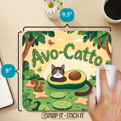 Mouse pad with avocado and cat design on a desk with a hand using a mouse.