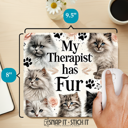 Product packaging with kittens and text 'My Therapist has Fur' on a desk with a mouse and coffee.