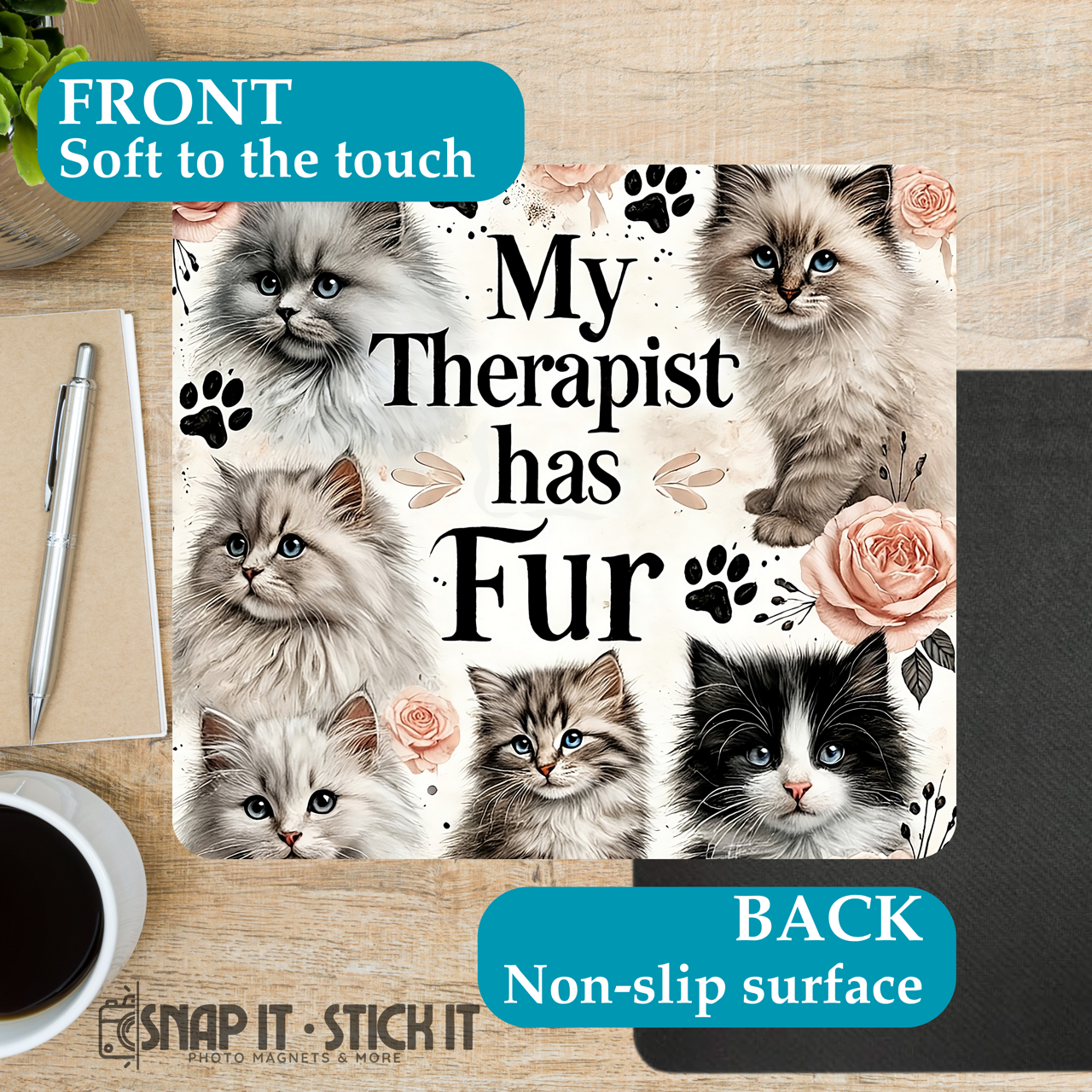 Notebook cover with cat illustrations and text on a wooden surface with coffee and pen.