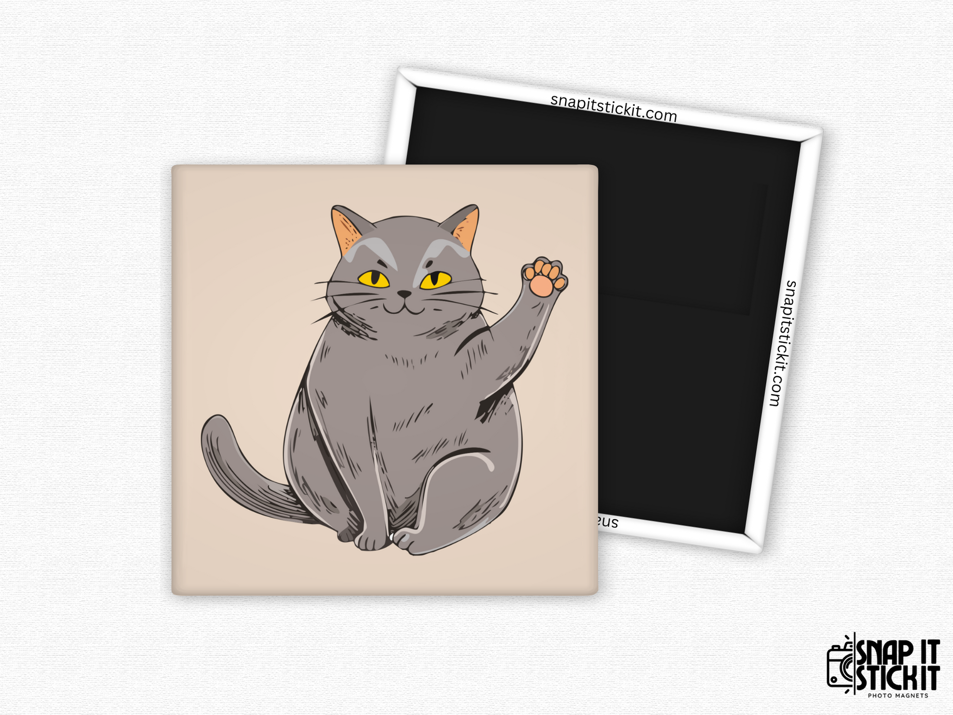 Gray cat waving fridge magnet – 2x2” square magnet featuring a cute cartoon gray cat with yellow eyes and raised paw on a beige background. Strong magnetic back with Snap It Stick It branding. Fun gift for cat lovers and pet parents.