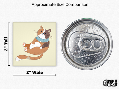 Calico cat with scarf magnet size comparison – 2x2” square fridge magnet of a cartoon cat wearing a blue scarf, lying on its back playfully, next to a soda can. Great for cat parents, seasonal fridge decor, or holiday stocking stuffers.