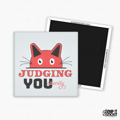 Fridge magnet with a red cat face and text 'Judging You Silently' on a white background.