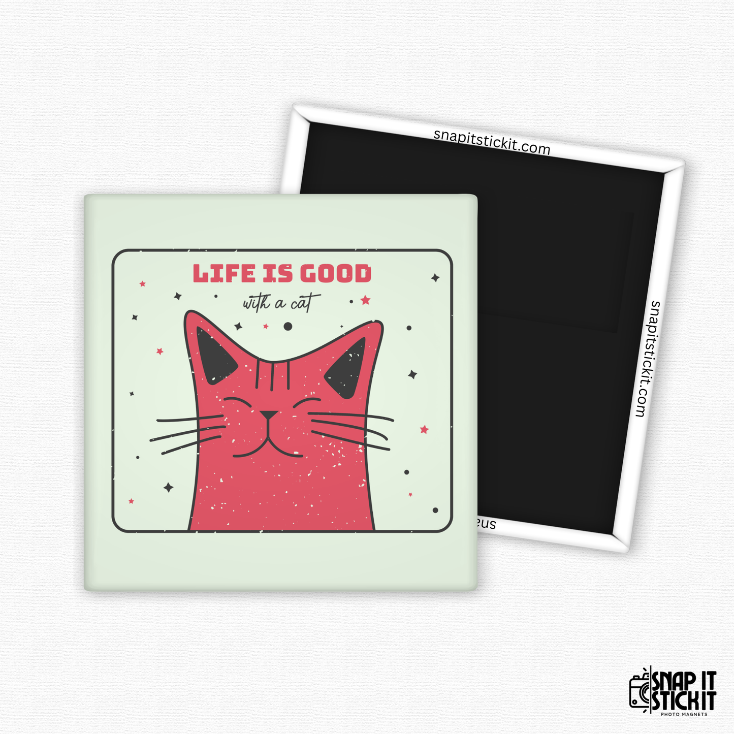 Fridge magnet with a pink cat illustration and 'Life is good with a cat' text on a light green background.
