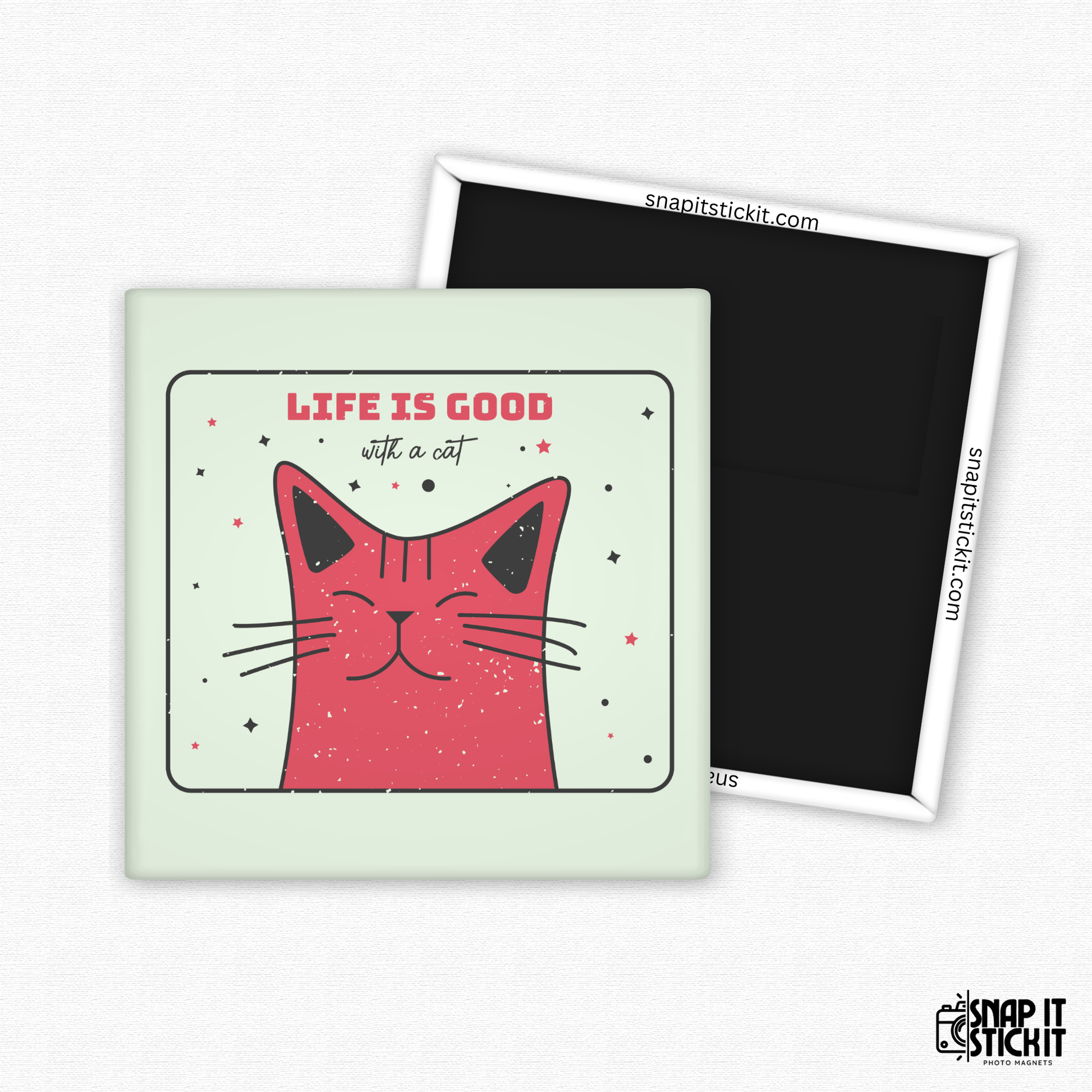 Fridge magnet with a pink cat illustration and 'Life is good with a cat' text on a light green background.