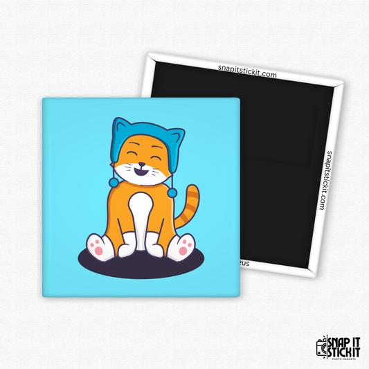 Fridge magnet with a cartoon cat design on a blue background