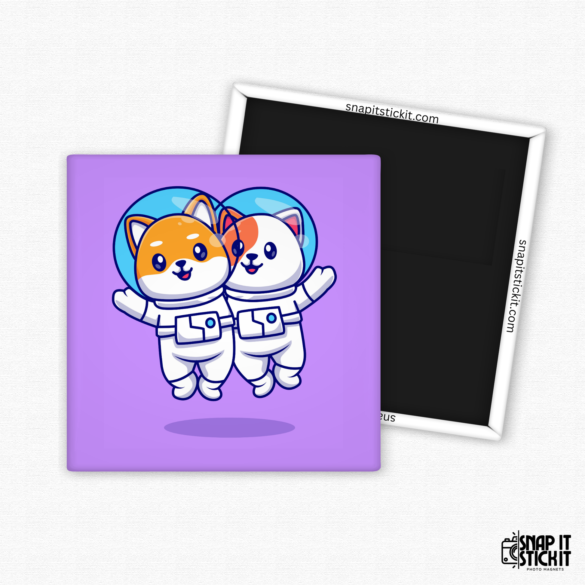 Two cartoon-style cats in astronaut suits floating side by side in space, against a purple background. 2x2 funny cat magnet. Handmade by Snap It Stick It.