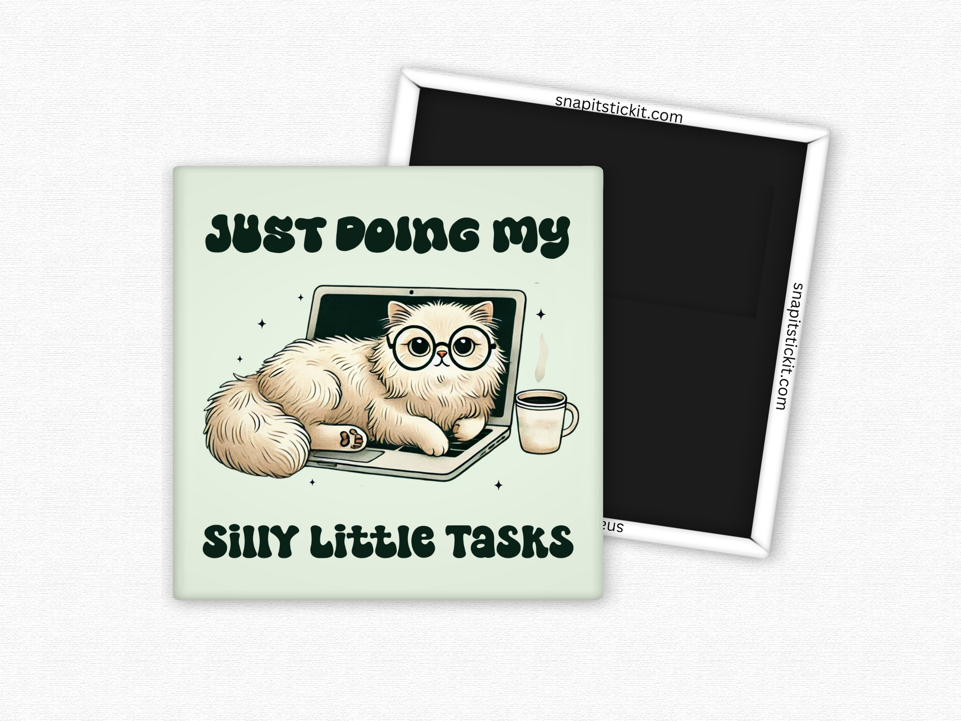Square magnet featuring a fluffy cat with glasses lounging on a laptop, next to a coffee mug, with the phrase ‘Just Doing My Silly Little Tasks’ in bold playful text.