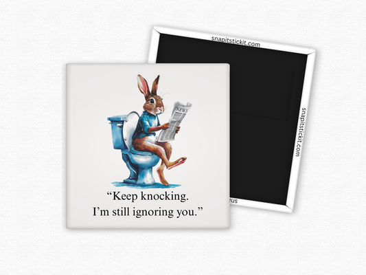 Funny rabbit bathroom magnet with a bunny on the toilet reading a newspaper and the quote “Keep knocking, I’m still ignoring you.”