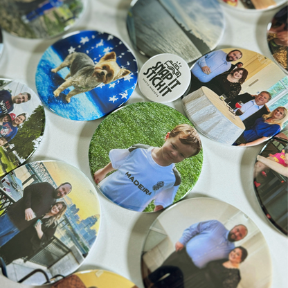 “Collection of custom photo magnets featuring family moments, pets, and nature photos, arranged in a flat lay with the Snap It Stick It logo magnet in the center. Highlights product variety and personalization options.”